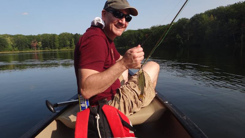 Joe with one of those big Reid Lake golden shiners, on the first fly he ever tied - a black Woolly Bugger, of course!