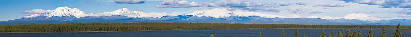 Here's a panorama of the Wrangell Mountains, viewed from a pullout overlooking Willow Lake along the Richardson Highway near Glennallen, Alaska.  A day this clear is rare, and the view is spectacular.  You have to view it full-sized to begin to appreciate what it's like scanning this range with binoculars.

From Richardson Highway in Alaska
