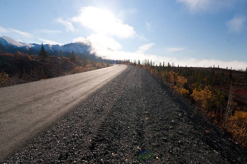 Looking back toward the Clearwater Mountains. ...as the road winds down behind me to the Susitna.

From Denali Highway in Alaska