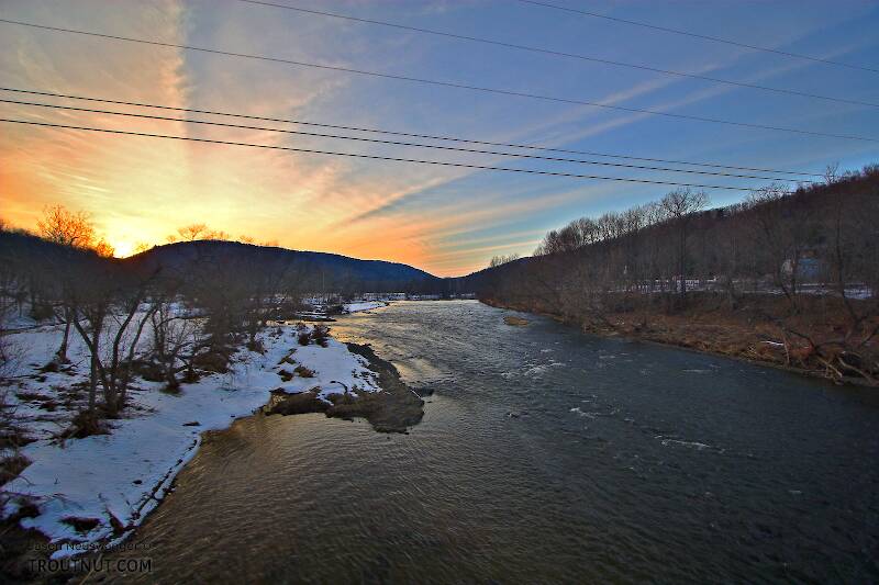 A late winter sunset radiates over a Catskill ridge.  This picture is taken near a popular landing on one of the main tailwaters.

From the West Branch of the Delaware River in New York