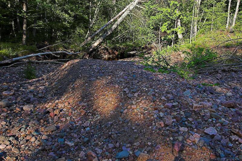 This huge pile of stones was deposited alongside a very small brook trout stream in a huge flood about 9 months before this photo was taken.

From Spring Creek in Wisconsin