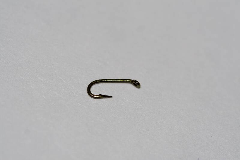 Here it is, next to a size-26 hook for comparison.